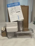 New Cooks Essentials Electric Mandolin/grater/slicer 6 Attachments Model IZVS001. Fixed Price $50.00.