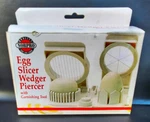 Norpro Egg Slicer/ Wedger/ Piercer/ With Garnishing Tool (new - Open Box). Fixed Price $9.95.