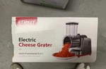 Atbkit Electric Cheese Grater/ Shredder/ Vegetable Slicer 6 Blades. Fixed Price $40.00.