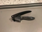 Handheld Kitchen Utensil Starfrit Garlic Press With Scraper. Fixed Price $5.44.