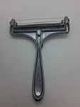 Vintage Cheese Slicer Taiwan Metal Roller & Wire Marked Kt Diamond Shape. Fixed Price $9.99.