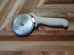 Mundial 5691-4 Pizza Cutter White Handle 3-7/8" Blade 9-1/4" Long. Fixed Price $24.00.
