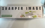 Sharper Image Mandoline Slicer With Interchangeable Slicing Blades. Fixed Price $9.99.