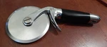 Black Kitchenaid Professional Empire Pizza Cutter Wheel With Finger Guard. Fixed Price $50.00.