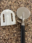 Pampered Chef Pizza Wheel Cutter With Plastic Protective Sleeve 1301. Fixed Price $20.99.