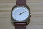 Slow Watches Mo 07 Single-hand 24-HOUR Octagonal, Brushed Gold, Swiss Quartz. Fixed Price $175.00.