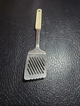 Leifheit Stainless Steel Slotted Spatula-white Handle-flat Wide Head With Ridges. Fixed Price $12.00.