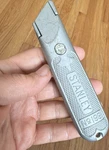 Stanley No. 199 Utility Knife Box Cutter, Metal Handle, Steel Blade, Silver. Fixed Price $15.00.