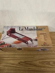 Buyer Mandoline Swing Red 2 Blades. Fixed Price $23.40.