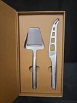 2PC Silver Cheese Knife & Slicer Peeler Set Made With Stainless Steel. Fixed Price $24.99.