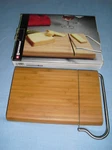 New Swissmar Bamboo Cutting Board With Cheese Slicer Blade. Fixed Price $15.29.