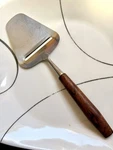 Vintage Boska Cheese Slicer Stainless Steel Beautiful Wood Grain Handle 8.25. Fixed Price $8.50.