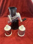 Nutrislicer Countertop Food With 3 Grating & Slicing Attachments. Fixed Price $13.75.