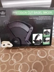 The Sharper Image Precision Cut Bagel Slicer. Fixed Price $59.00.