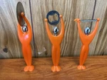 Bugatti Gym Kitchen Utensil Set Pizza Cutter, Peeler, Bottle Opener Orange. Fixed Price $7.95.