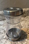 Progressive Clear Plastic Graduated 2-TIER Measuring Cup With Lids. Fixed Price $15.00.