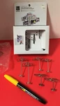 9 Umbra Camera Clip-it Photo Holders In Nickel. Fixed Price $12.00.