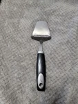 Oneida Cheese Slicer / Plane Stainless Steel With Black Handle. Fixed Price $19.99.
