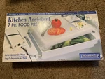 Kitchen Assistant 7 Pc. Food Prep Set Slicer, Grating, Julienne & More! PCB-3000. Fixed Price $79.99.