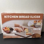 Brand New In Box Firjuty Kitchen Bread Slicer (with Crumb Catcher). Fixed Price $20.00.