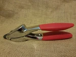 Trudeau Red Handled Garlic Press. Fixed Price $22.00.